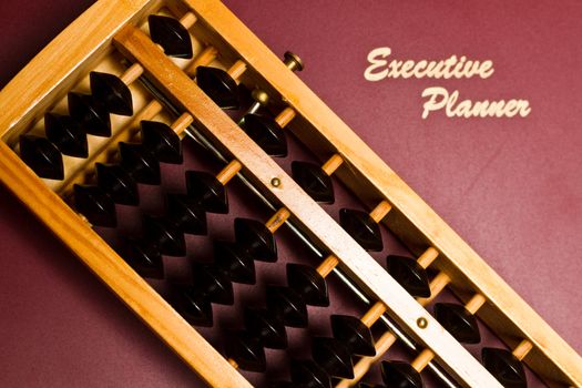 focusing on the abacus on top of executive planner