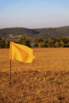 golf drive range in Mahabhaleshwar India, 100 metre colored flag markers, portrait, crop margin and empty negative areas