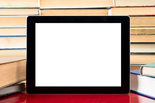 tablet pc with blank screen on a book background