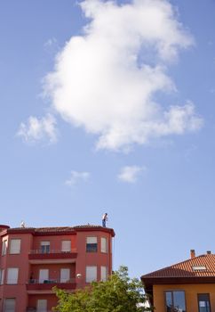 A man working on a roof, Leon