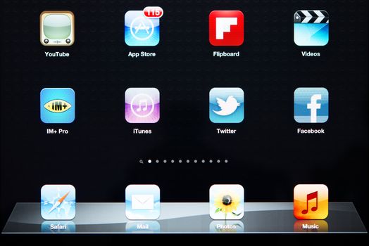 Crimea, Ukraine - October 3, 2012: A close up of an illuminated Apple iPad New screen showing the App Store and various apps