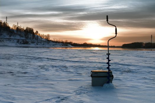 Sunset in the winter on winter fishing