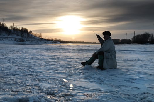 The fisherman on winter fishing 