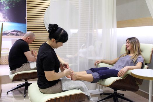 Foot massage and care in a beauty salon