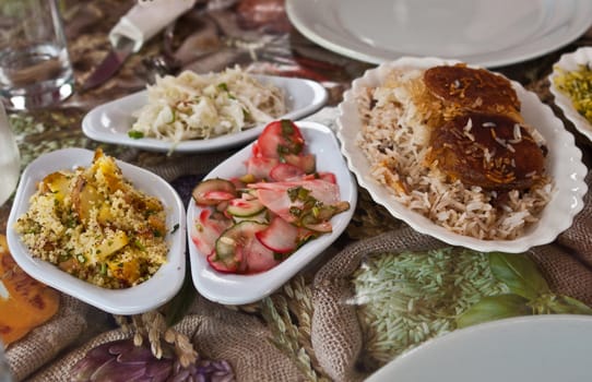 Traditional rich arabian dinner in a restaurant with many dishes