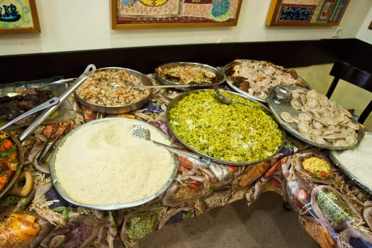 Traditional rich arabian dinner in a restaurant with many dishes