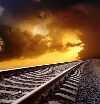 railway to horizon under dramatic sky
