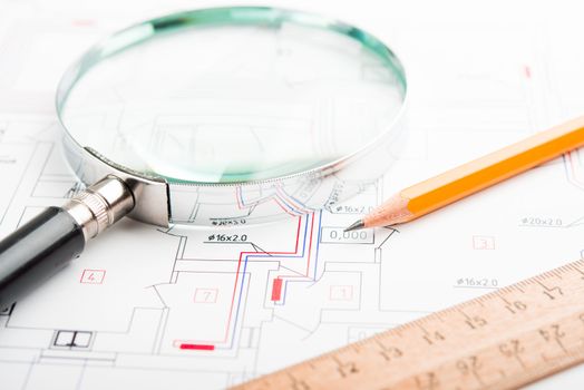Drafting Tools on a blueprint. Pencil, lens etc.