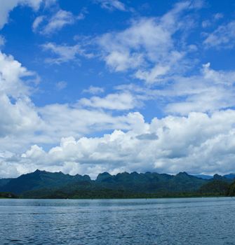 Lake shore under blue sky