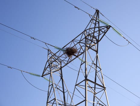 A stork nest on an electricity pylon, Spain
