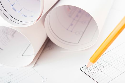 Rolls of Blueprints and pencil. Architectural Concept