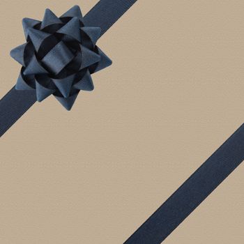Dark bow and ribbons on textured background