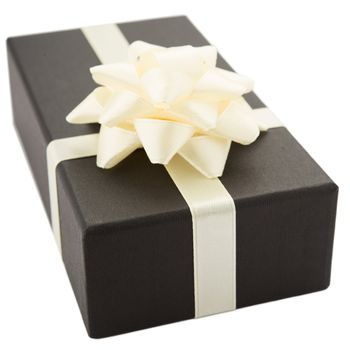 Black gift box with white bow, isolated on white background