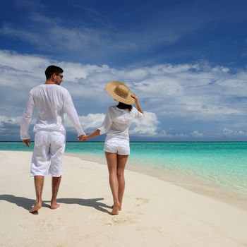 Couple on a tropical beach at Maldives