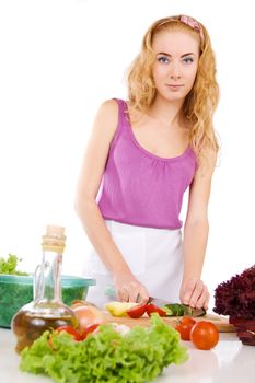 Woman with food ingredients cooking over white