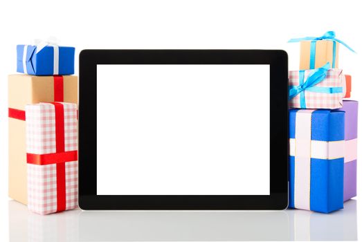 Tablet pc with gift boxes isolated on white background