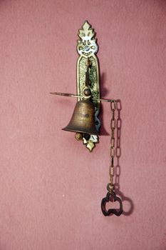 metal doorbell antique on the wall