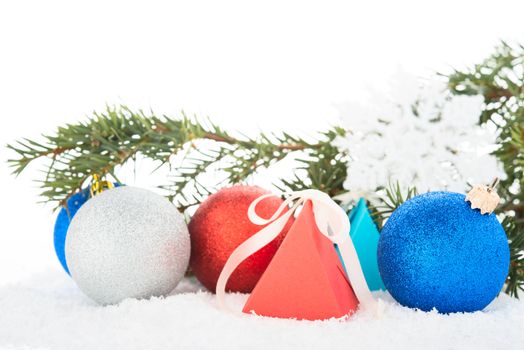 Christmas tree and decorations on a snow.