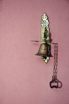 metal doorbell antique on the wall