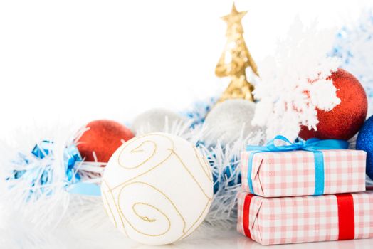 Christmas decorations and gifts on white background.