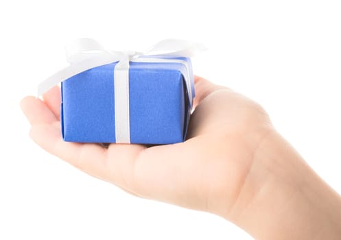 gift in a children's hand on white background