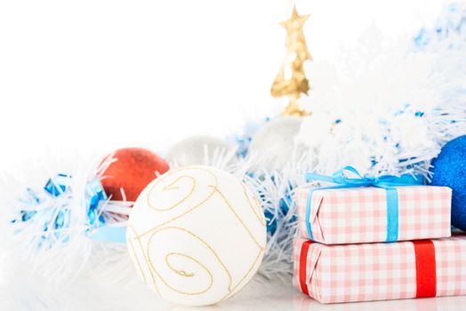 Christmas decorations and gifts on white background.
