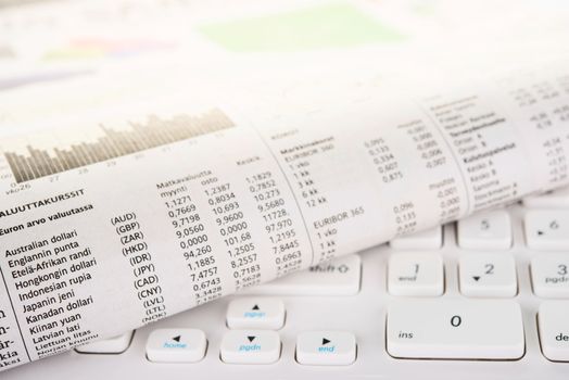 Newspaper on a white keyboard