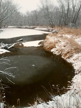Snowy day along the Kishwaukee River of Illinois - USA.
