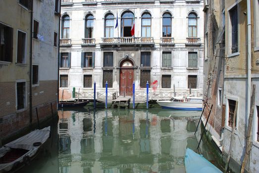 Venice canal with old house and color