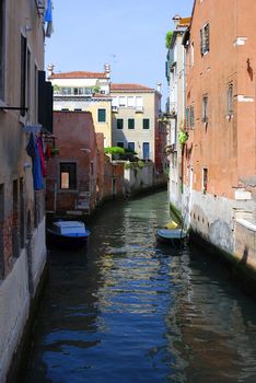 Venice canal with old house and color