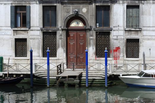 Venice canal with old house and color