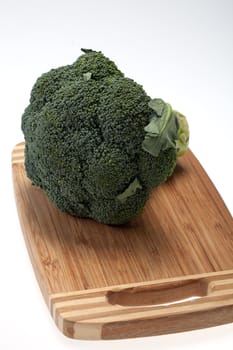 brocolli on the cutting board on the white background 