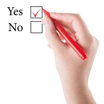 Hand with red marker draws Yes in checkbox