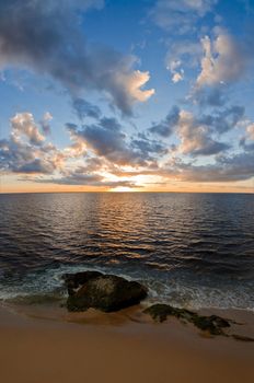 beautiful sunset over the smooth surface of a mountain lake