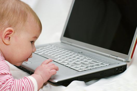 Baby working on Laptop
