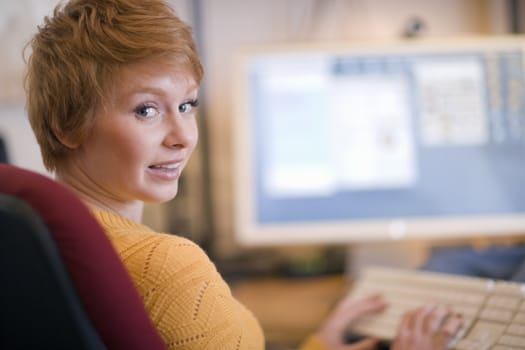 Young woman working at a computer