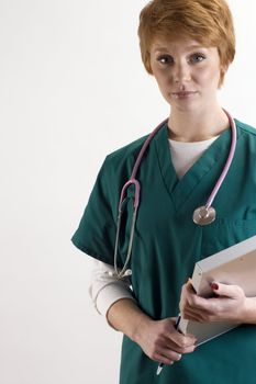 Portrait of female medical personnel wearing scrubs and stethoscope