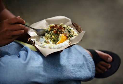 The Indonesian kitchen. Rice with an egg and vegetables