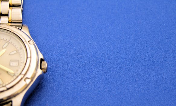 View of a watch up close on a blue background