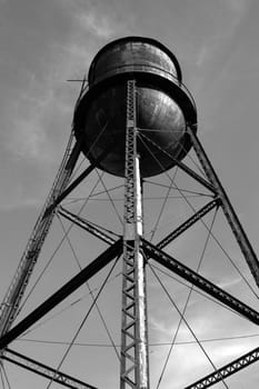                                 A old water tower shown in black and white