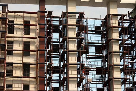 construction workers in action on a modern building horizontal