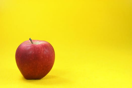 red apple in yellow background food and fruits