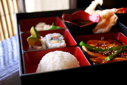 Assorted japanese food bento served a wooden box