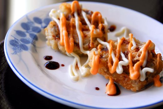 Gourmet japanese food deep frlied maki roll served on a plate