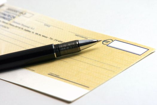 business deal money check writing with ballpen in white background