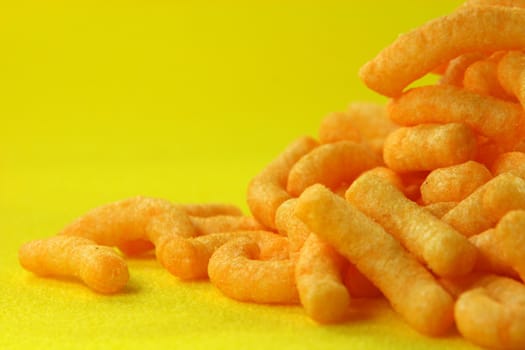 potato snacks closeup with yellow background food concepts