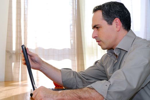 Man sitting at a desk and looking into his computer