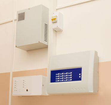 The control units fire alarm mounted on the wall