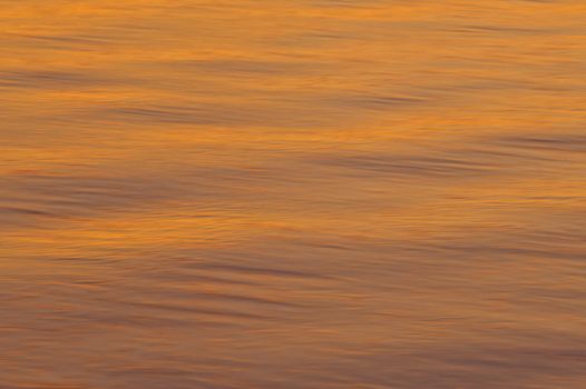 Orange colored water ripples in the Nicoya Gulf, Costa Rica.