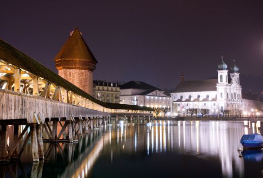 Famous wooden Chapel bridge foot walkway in Lucerne, Switzerland
